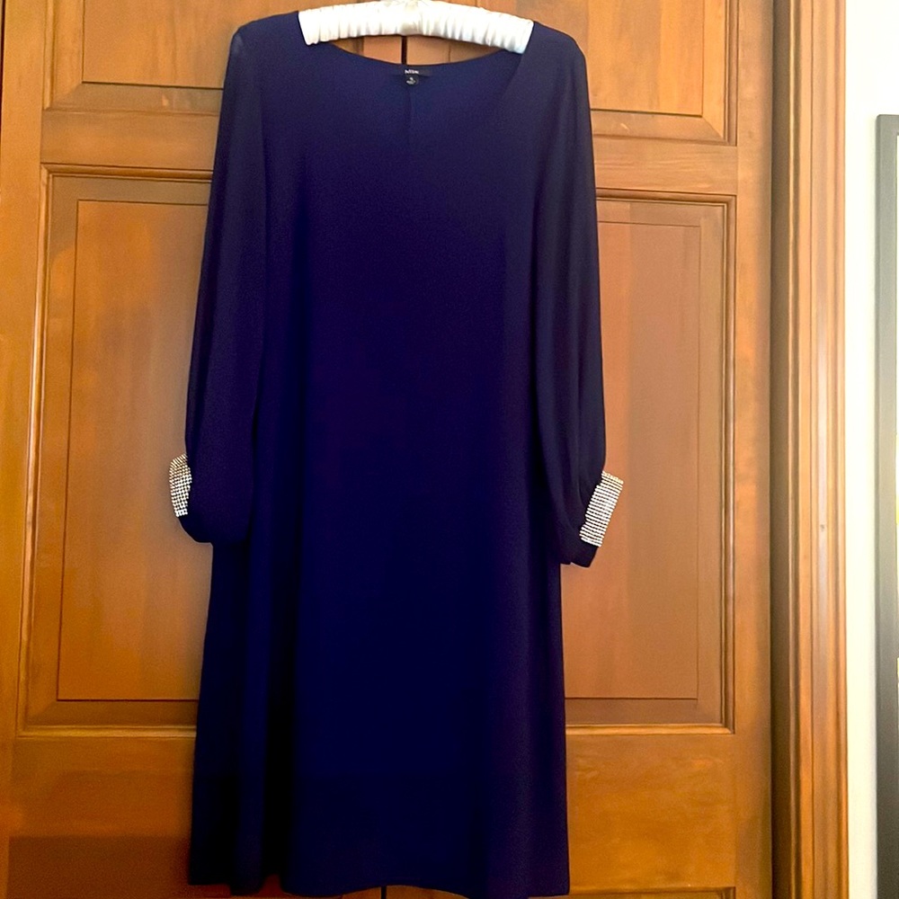 Royal blue sheath dress with rhinestone embellishment.